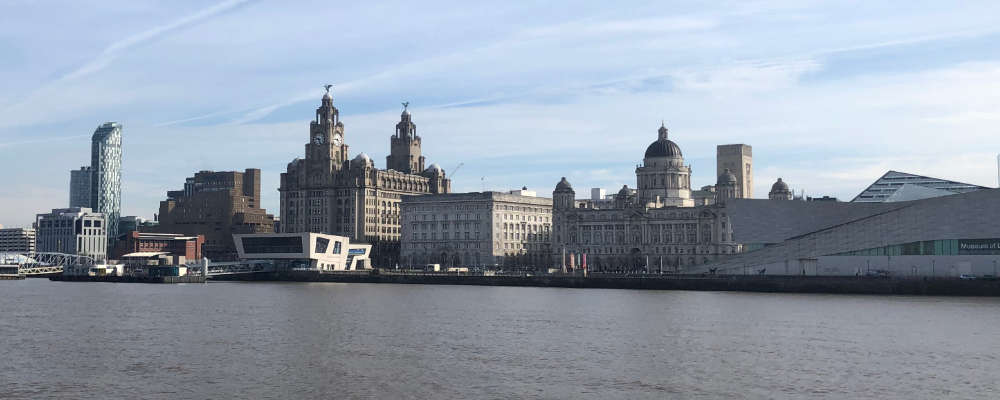 The waterfront of Liverpool showing the Three Graces, Liverpool museum and the ferry landing stage.