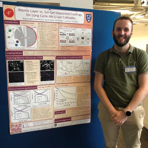 Rory standing by his poster at ECNW 22
