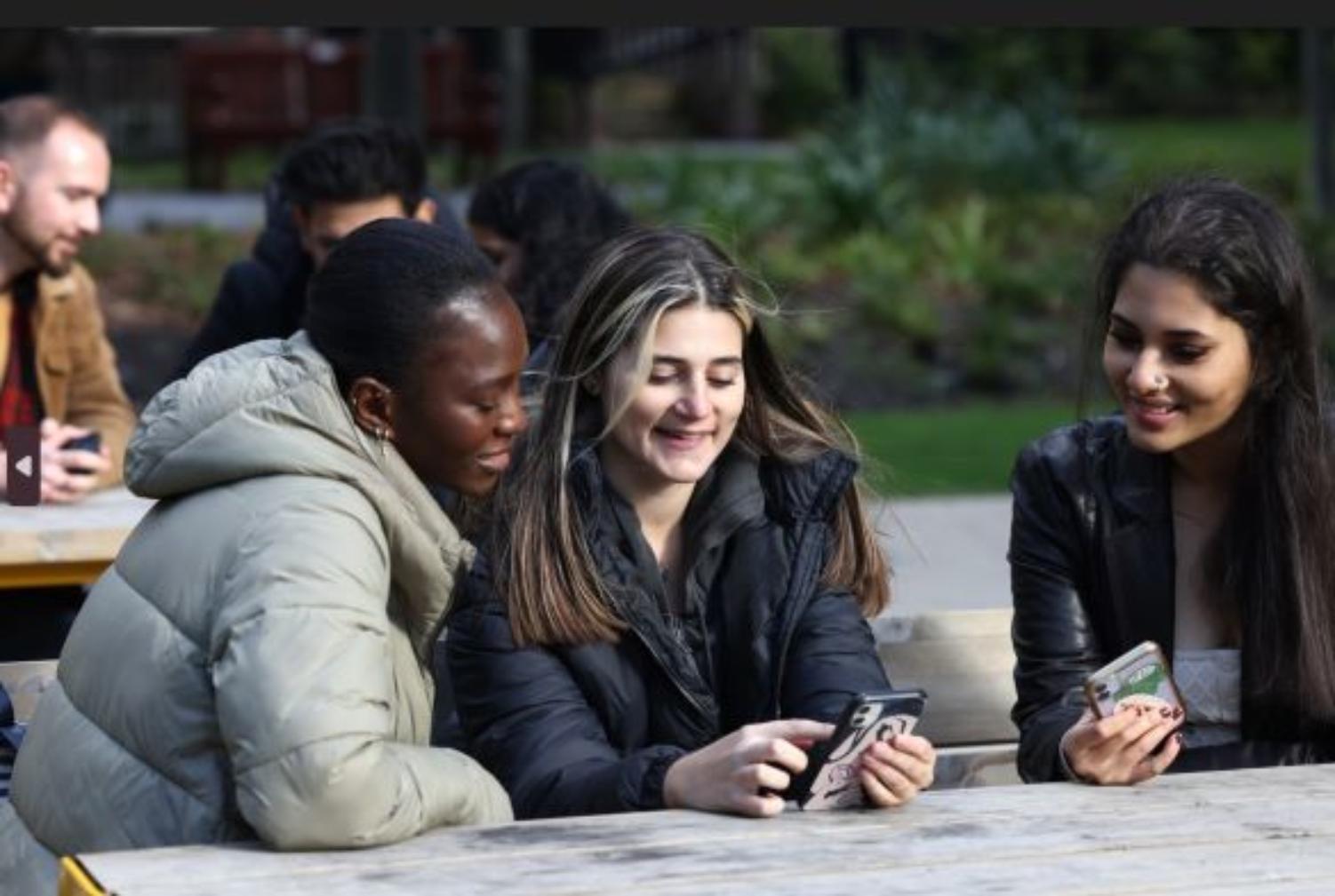 Students looking at phones