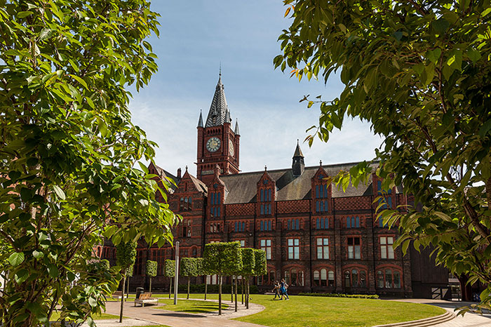 University of Liverpool building half hidden by leaves