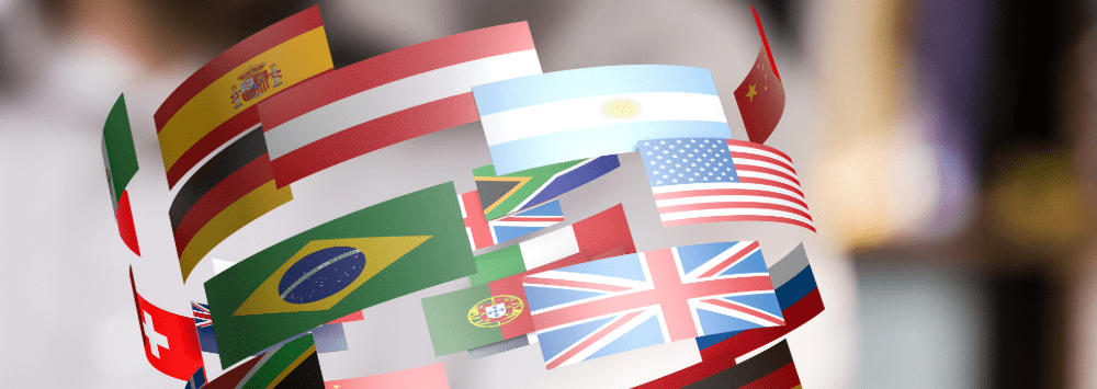 A banner image for the Year Abroad section of the website, depicting multiple flags from around the world